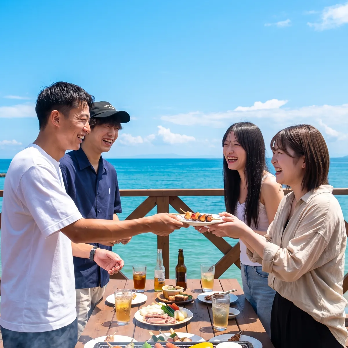 海を見ながらBBQをする男女4人